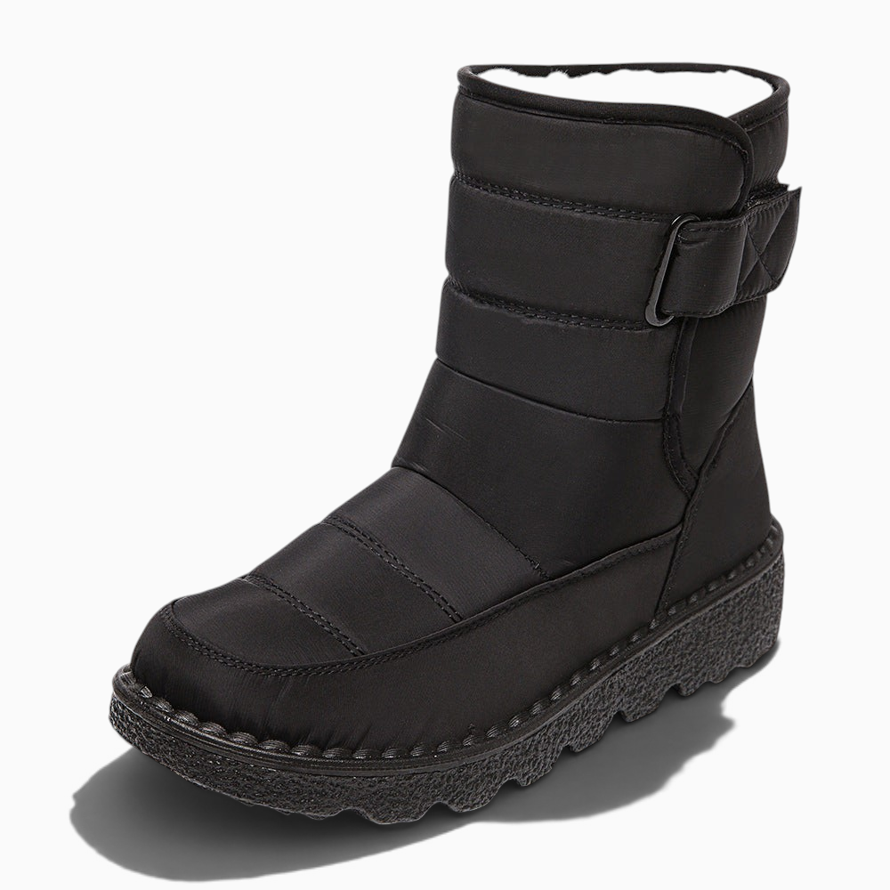 Boots de neige femme noires Orthopodys FRIMORA avec tige haute matelassée, sangle réglable et semelle plateforme crantée