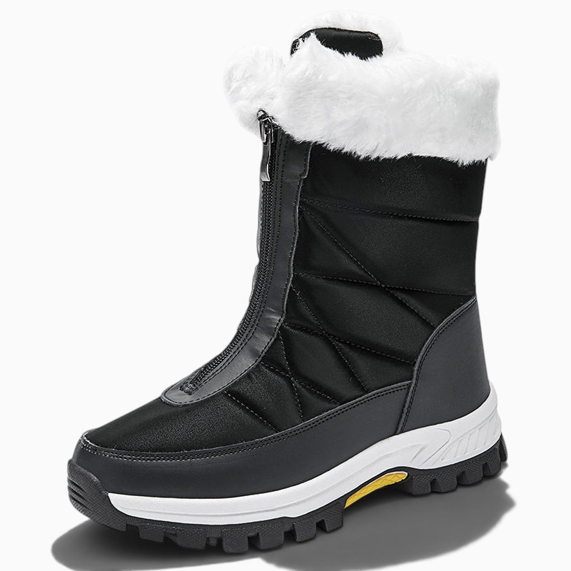 Bottes de neige femme Orthopodys noires et blanches avec fourrure artificielle, fermeture zippée et semelle crantée.