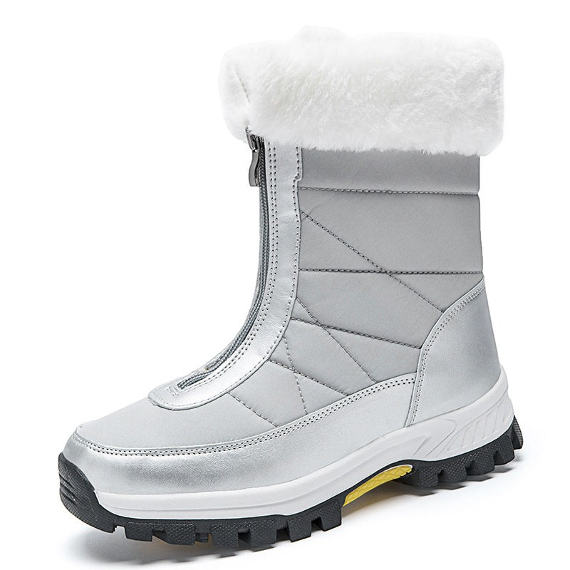 Bottes de neige femme Orthopodys, marque exploitée par AIIBORI (SASU), argentées avec fourrure blanche et zip avant.