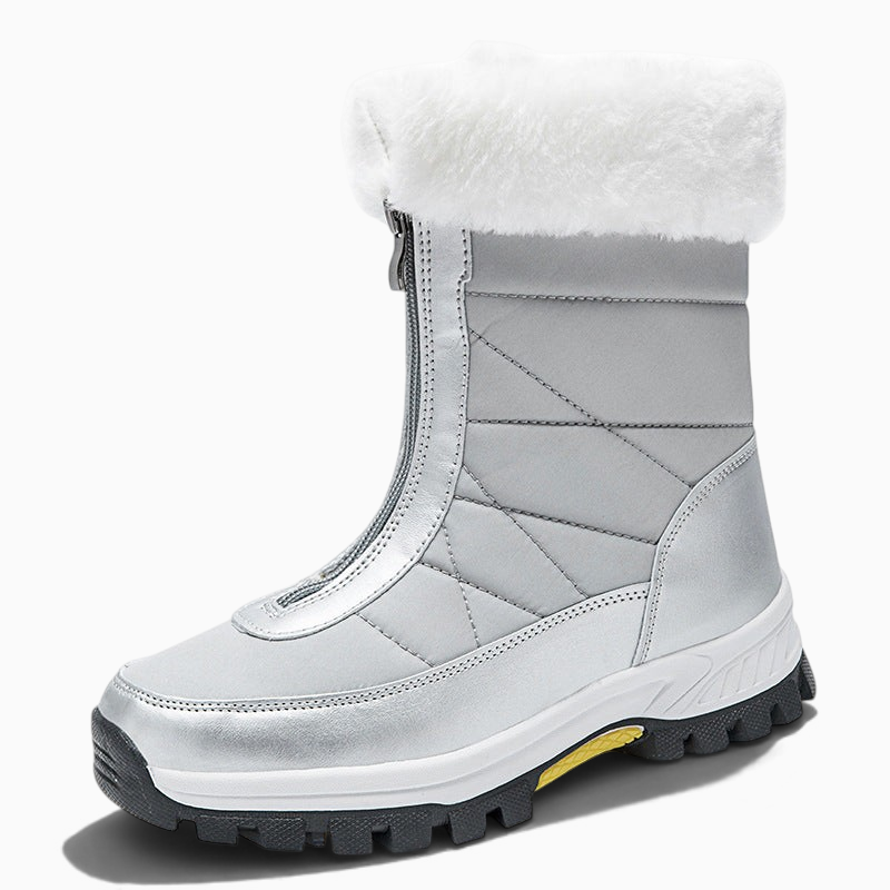 Bottes de neige femme Orthopodys, marque exploitée par AIIBORI (SASU), argentées avec fourrure blanche et zip avant.