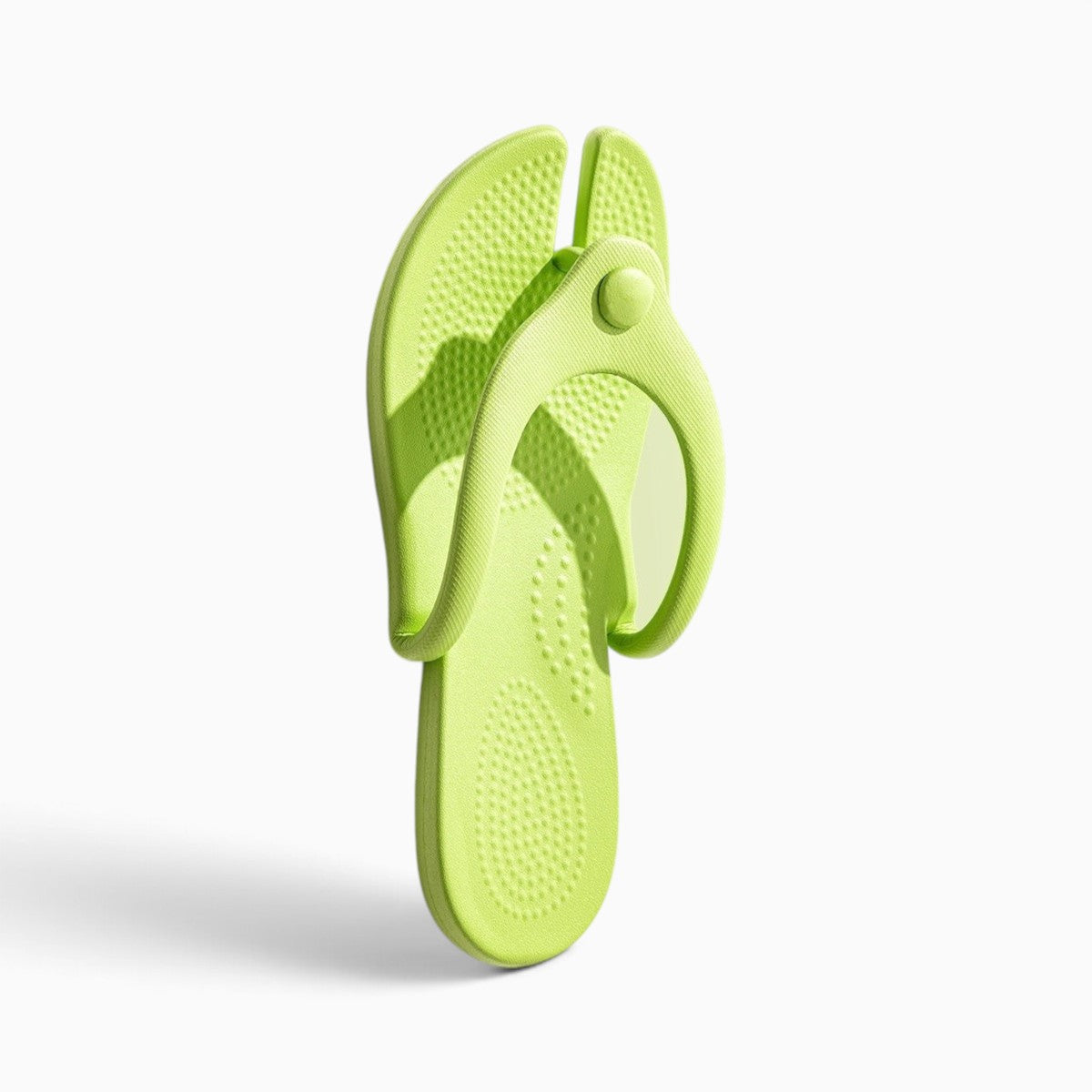 Tong pliable Orthopodys, marque exploitée par AIIBORI (SASU) en EVA vert citron, compacte pour le voyage et la plage